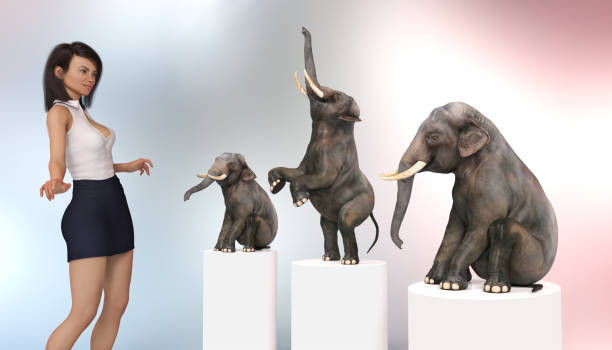 istock Female circus tamer with dwarf elephants 1137331646
