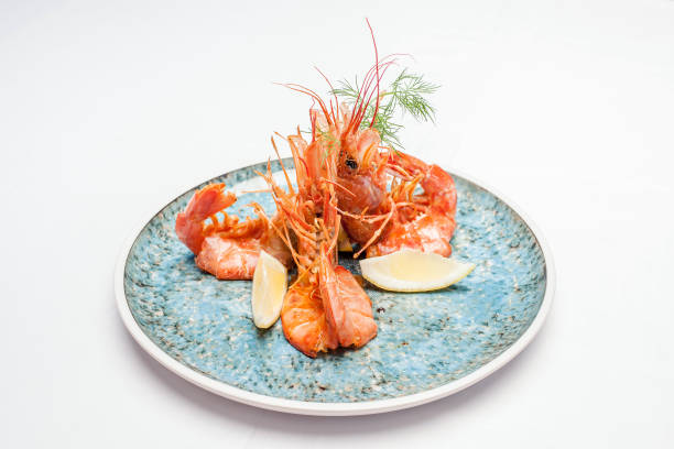 istock Shrimps on a plate on a white background 1137333014