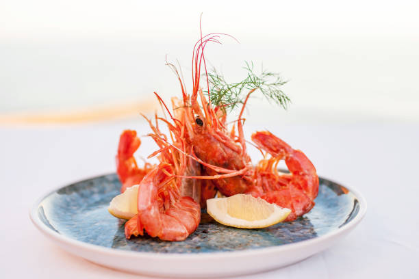 istock Shrimps on a plate on a white background 1137333030