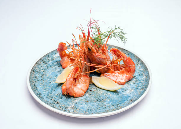 istock Shrimps on a plate on a white background 1137333031