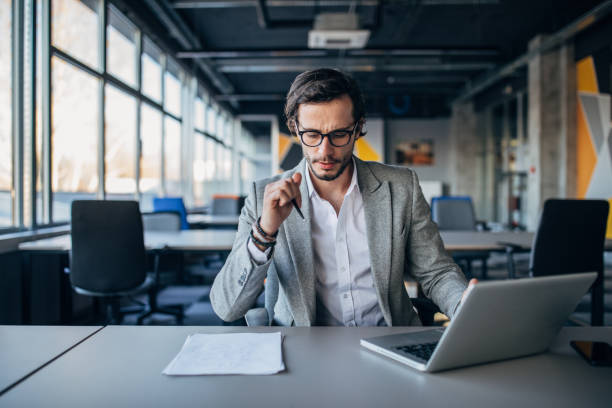 istock Modern businessman working in office 1137334198