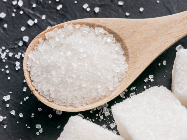 istock background of white sugar on black 1137334218