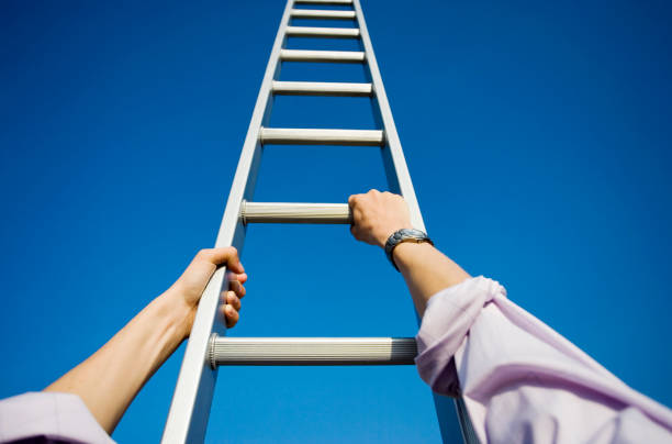 istock Businessman climbing a ladder 1137334712