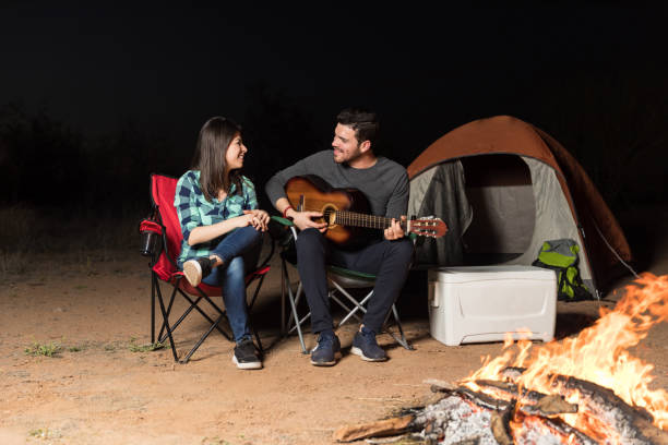 istock Couple Enjoying Their Date By Campfire 1137335067