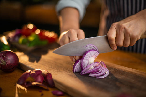 Cutting onions Cutting onions chopped stock pictures, royalty-free photos & images