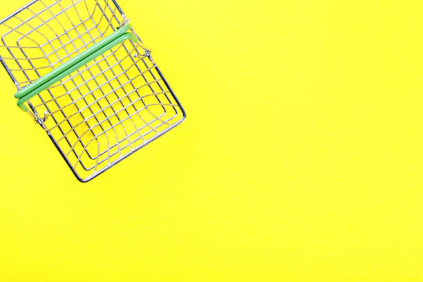 istock Shopping basket is empty on a bright yellow background. Conception Festive Sale Discount. Trading Supermarket Retail.Copy space .Top View. Flat Lay. 1137338345