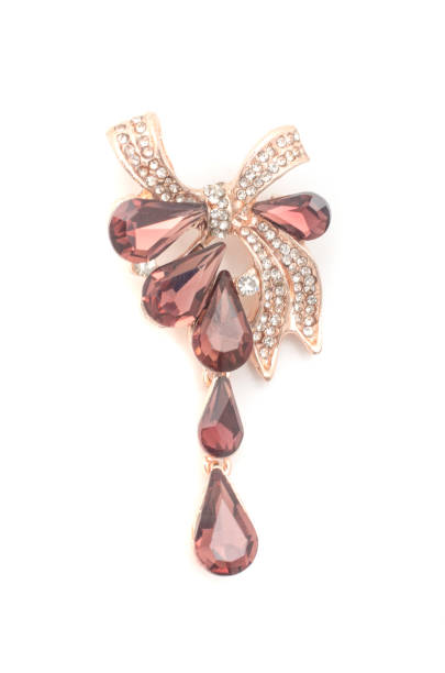 istock golden brooch bow with diamonds and rubies and drops isolated on white 1137338636