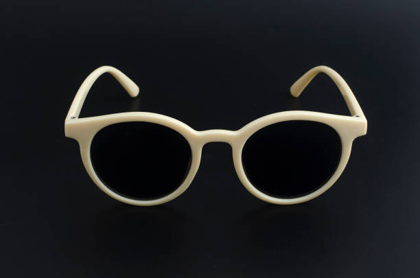 istock round retro sunglasses in plastic rim isolated on black 1137338671