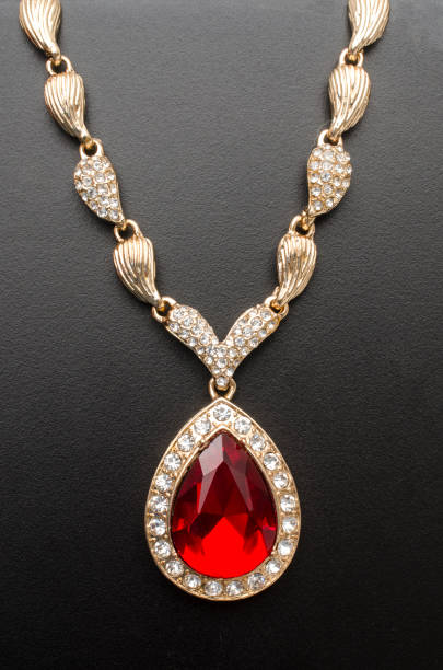 istock golden pendant with ruby and diamonds isolated on black macro 1137338674