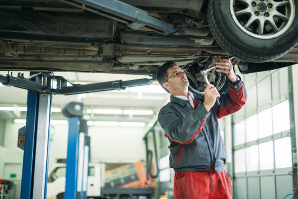 istock Auto mechanic working in garage. Repair service. 1137339811