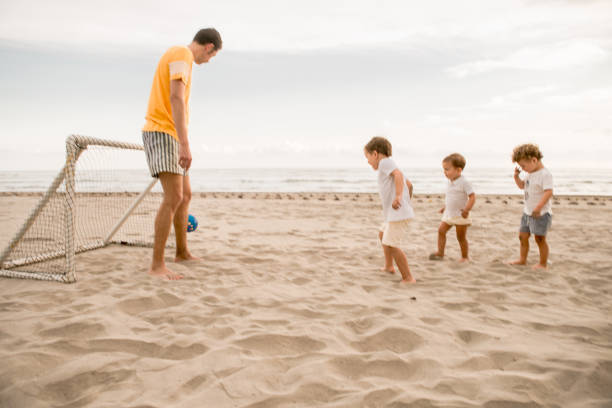 istock Family Playing Soccer 1137343317
