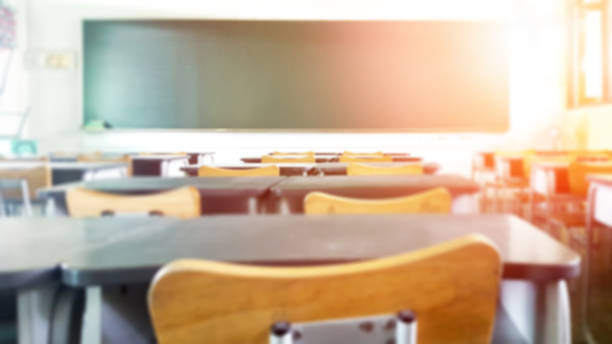 istock School classroom in blur background without young student; Blurry view of elementary class room no kid or teacher with chairs and tables in campus. 1137343471