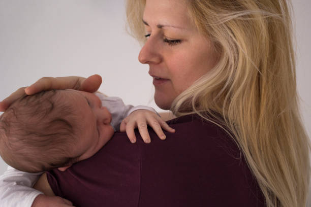 istock Newborn baby boy with his mother 1137344377