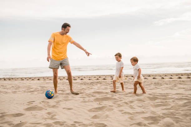 istock Family Playing Soccer 1137344478