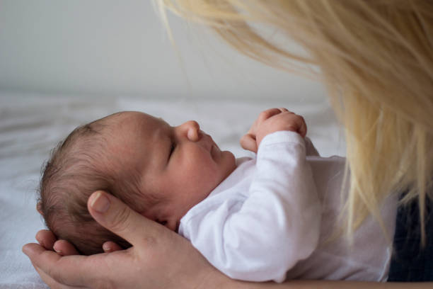 istock Newborn baby boy with his mother 1137344513