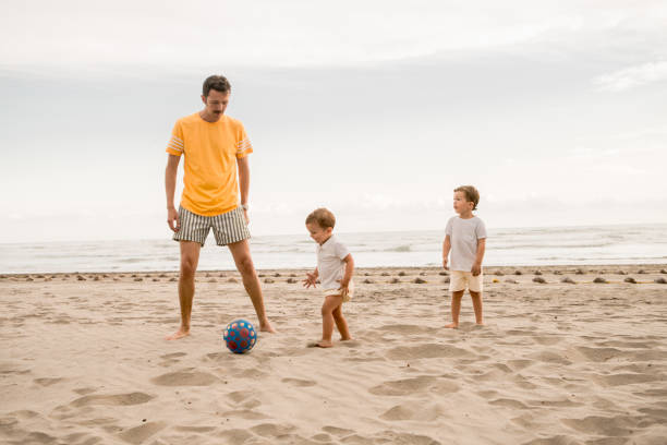 istock Family Playing Soccer 1137344539