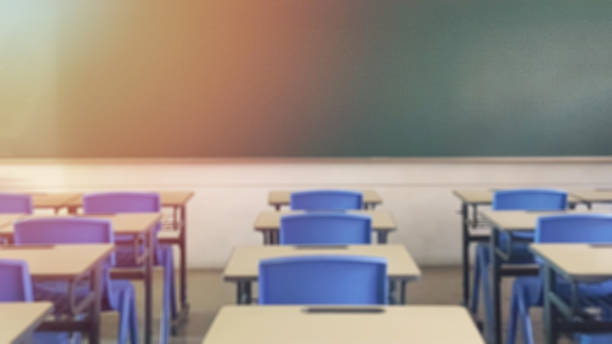 istock School classroom in blur background without young student; Blurry view of elementary class room no kid or teacher with chairs and tables in campus. 1137346366