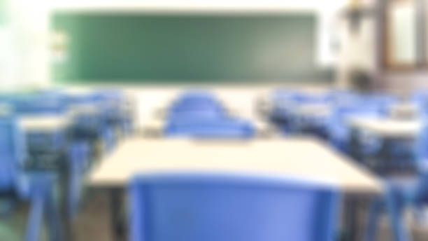 istock School classroom in blur background without young student; Blurry view of elementary class room no kid or teacher with chairs and tables in campus. 1137346370