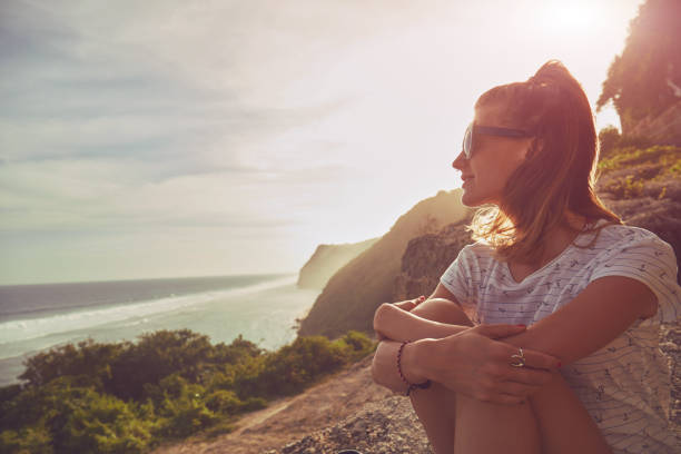 istock Tourist girl with backpack enjoying the view. 1137346478