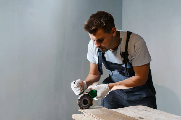istock Wood cutting with using a Circular Saw. Construction Worker and the Woodworking. House renovation laminate flooring cutting 1137346572