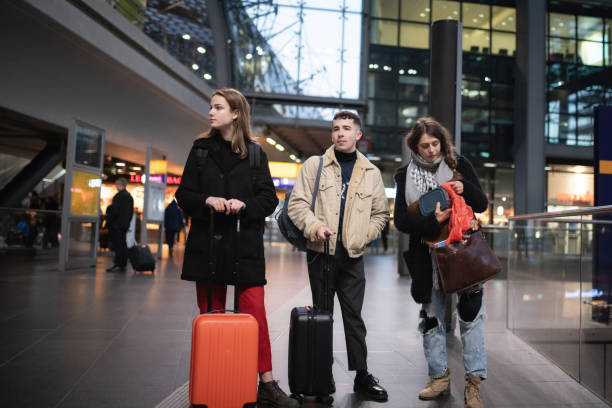 istock three young travellers waiting inside the train station 1137346626