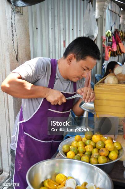 Street Vendor Sells Fresh Orange Juice Stock Photo - Download Image Now - Adult, Adults Only, Asia