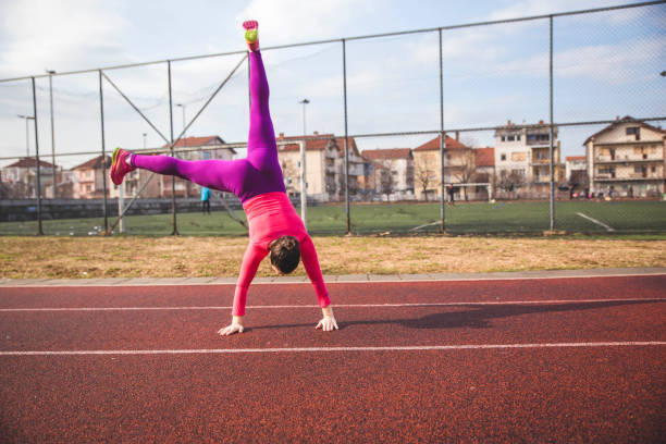 istock Young woman doing Cartwheel 1137347877