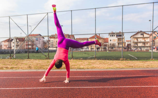 istock Young woman doing Cartwheel 1137347922