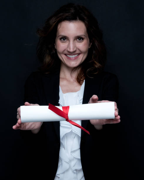istock Businesswoman is holding a diploma 1137348805