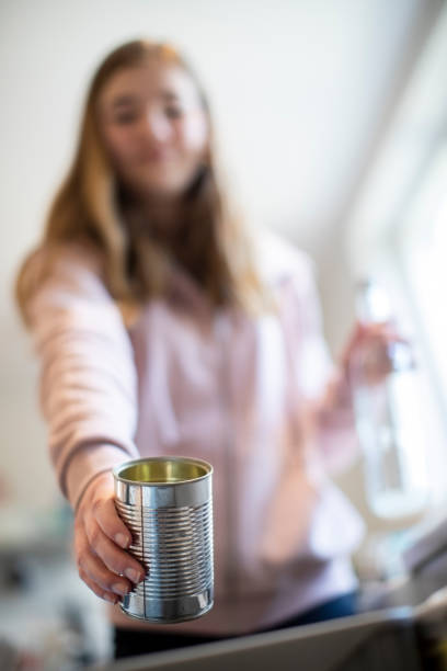istock Teenage Girl Sorting Recycling Into Kitchen Bin At Home 1137349676