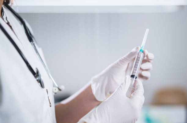 istock Female doctor holding injection 1137350559