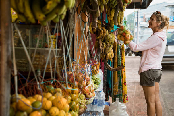 istock Woman Choosing Fresh Fruit 1137350606