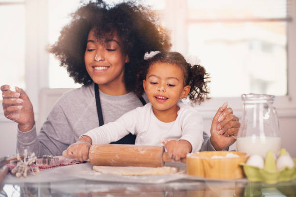 Mother and daughter are baking together