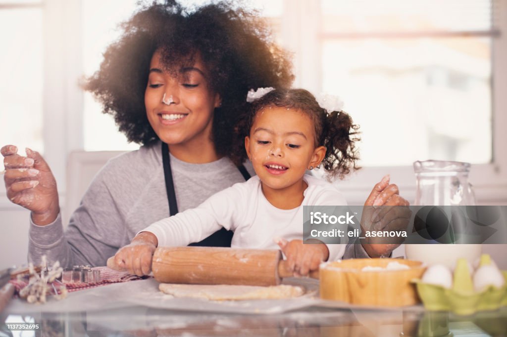 Mother and daughter are baking together Mother Stock Photo