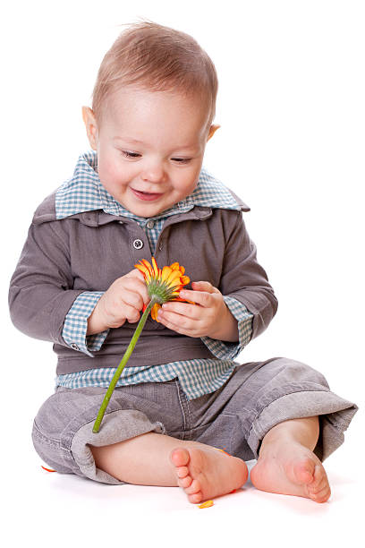 istock Smiling baby with flower 113735304