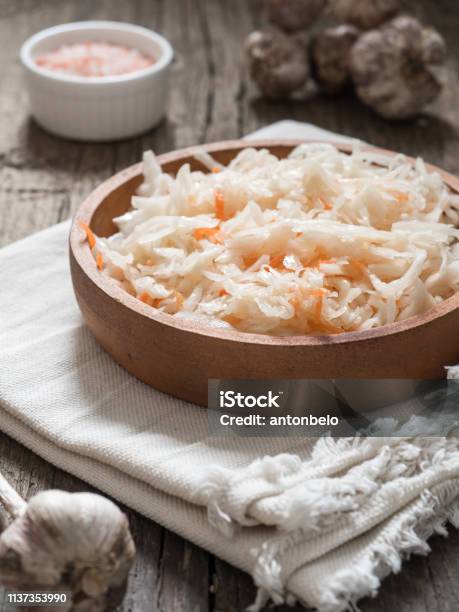 Sauerkraut Fermented Cabbage In A Brown Clay Plate On A Wooden Table Healthy Vegetarian Food And Best Natural Probiotic Stock Photo - Download Image Now