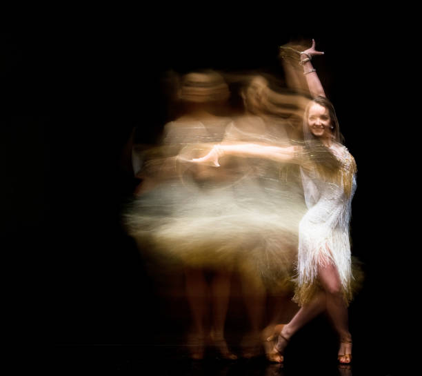 istock Beautiful woman ballroom dancing with motion blur 1137354113
