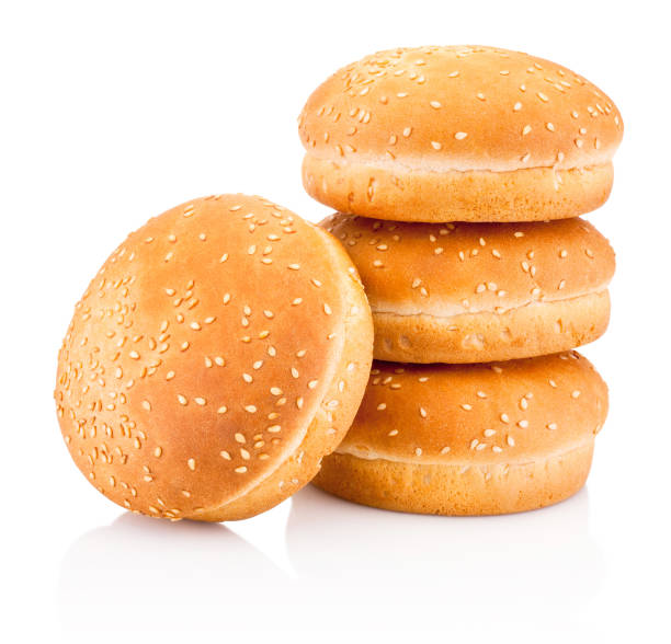 istock Four hamburger buns with sesame isolated on white background 1137355421