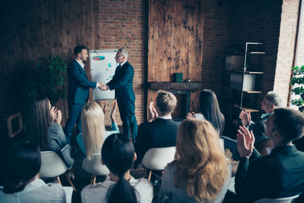 istock Nice trendy stylish elegant sharks marketers manages ceo boss chief conference shaking hands welcome to start-up project at modern industrial loft interior work place space indoors 1137357792