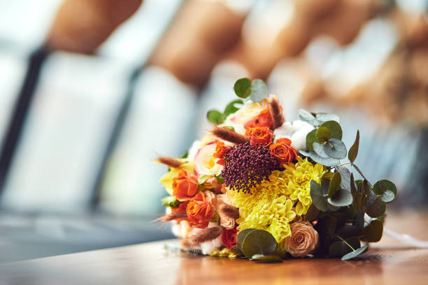 istock beautiful bridal wedding bouquet lying on the table 1137358645