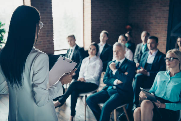 istock Nice focused crowd of beautiful handsome elegant classy stylish executive top managers attending corporate conference class course lecture lecturer at industrial loft style interior work place station 1137358659