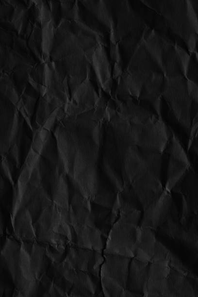 istock Dark black blank paper backgrounds creased crumpled surface old torn ripped posters grunge textures placard 1137360902