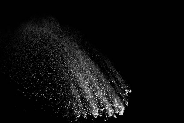 istock Bizarre forms of white powder explosion cloud against black background.White dust particles splash. 1137361512