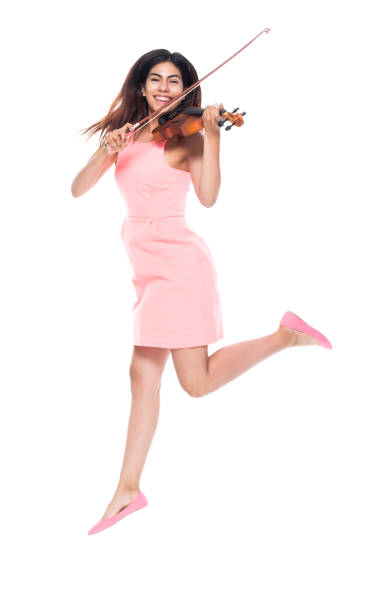 istock Cute female playing the violin while jumping 1137366394