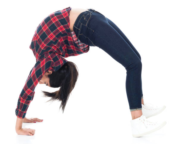 istock Beautiful young latino female bending over backward 1137367672