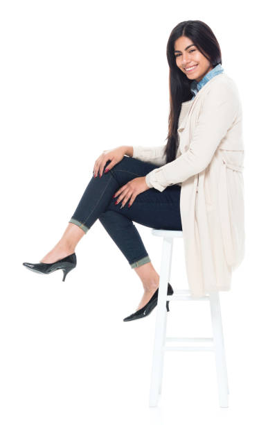 istock Attractive young latino female is sitting 1137367994