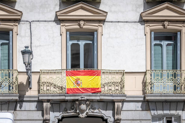 istock Spanish flag flying outside on a city centre building 1137368166