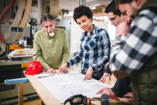 istock Small group of people planning the new architecture project in the workshop 1137368240