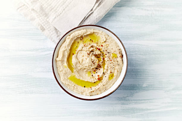 A bowl of homemade Hummus. Close up. Copy space. Vegan food stock photo