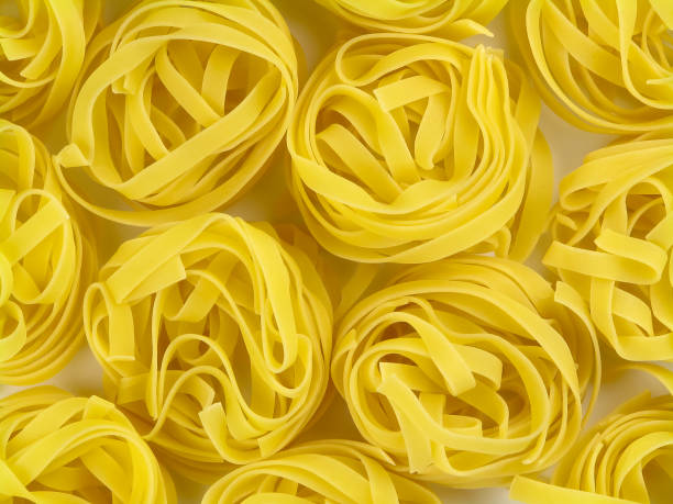 istock Tagliatelle nests italian pasta texture 1137369740